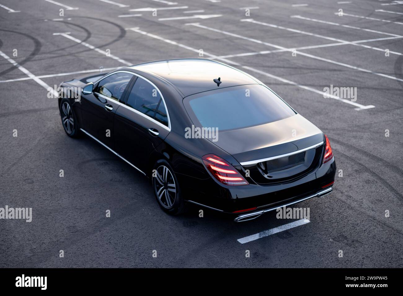 Luxury black car on a parking lot Stock Photo - Alamy