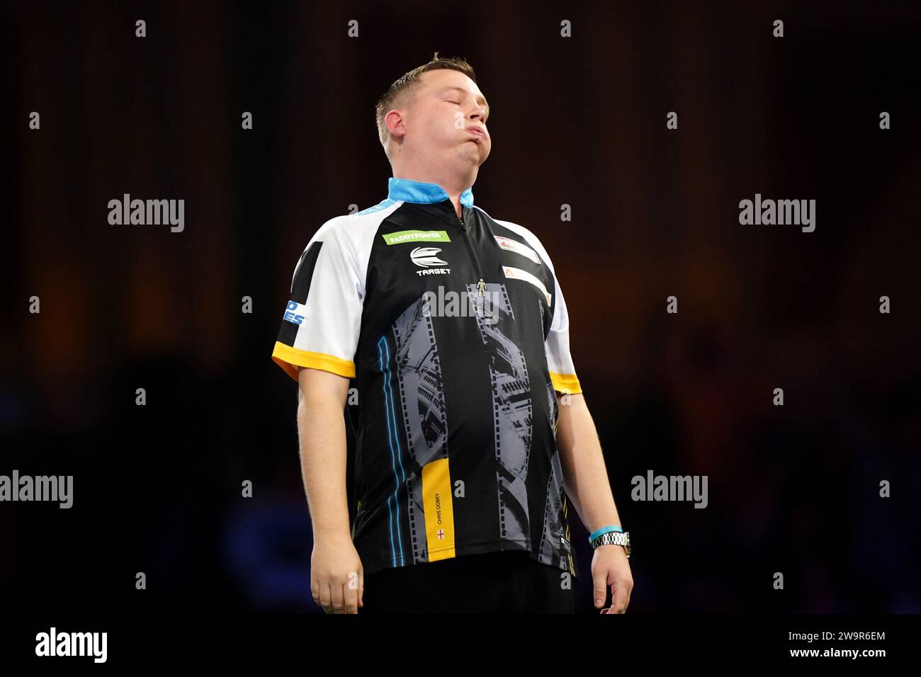 Chris Dobey celebrates after beating Michael Smith (not pictured) on