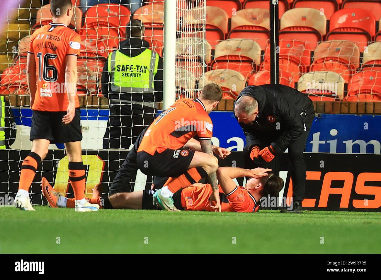 29th December 2023; Tannadice Park, Dundee, Scotland: Scottish Championship Football, Dundee United versus Partick Thistle; Declan Gallagher of Dundee United is treated for an injury Credit: Action Plus Sports Images/Alamy Live News Stock Photo