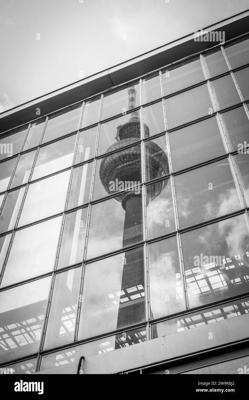 Reflection of the Berlin TV tower (Fernsehturm) in the glass windows of Alexanderplatz train station in Berlin Mitte district, Berlin, Germany, Europe Stock Photo