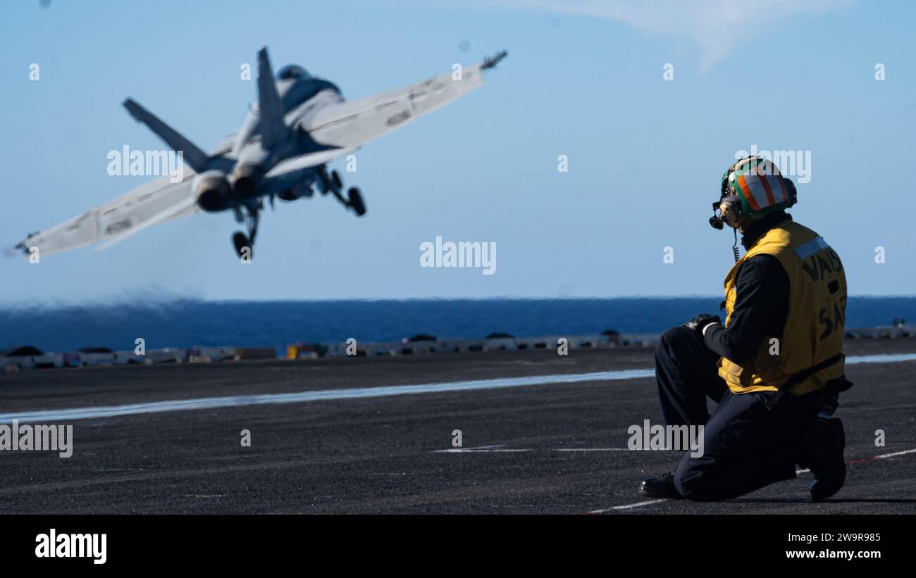 An F/A-18E Super Hornet, attached to the 'Golden Warriors' of Strike Fighter Squadron (VFA) 87, launches from the flight deck of the world's largest aircraft carrier USS Gerald R. Ford (CVN 78), Nov. 15, 2023. The Gerald R. Ford Carrier Strike Group is conducting routine operations in the Mediterranean Sea. The U.S. maintains forward-deployed, ready, and postured forces to deter aggression and support security and stability around the world. (U.S. Navy photo by Mass Communication Specialist 3rd Class Maxwell Orlosky) Stock Photo
