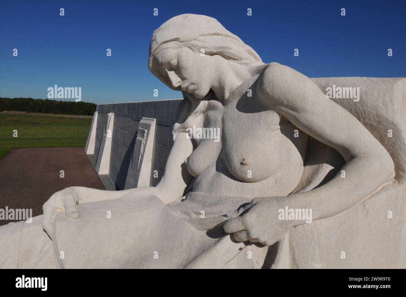 A sculpture of a female mourner at the base of the Canadian National Vimy Memorial, a First World War monument designed by Walter S. Allward in France. Stock Photo