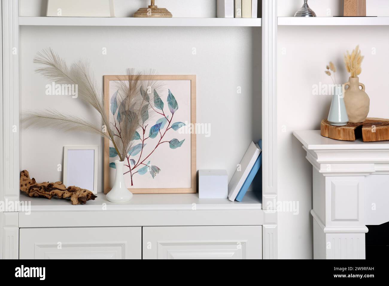 Shelving unit and fireplace with different decor indoors. Interior ...