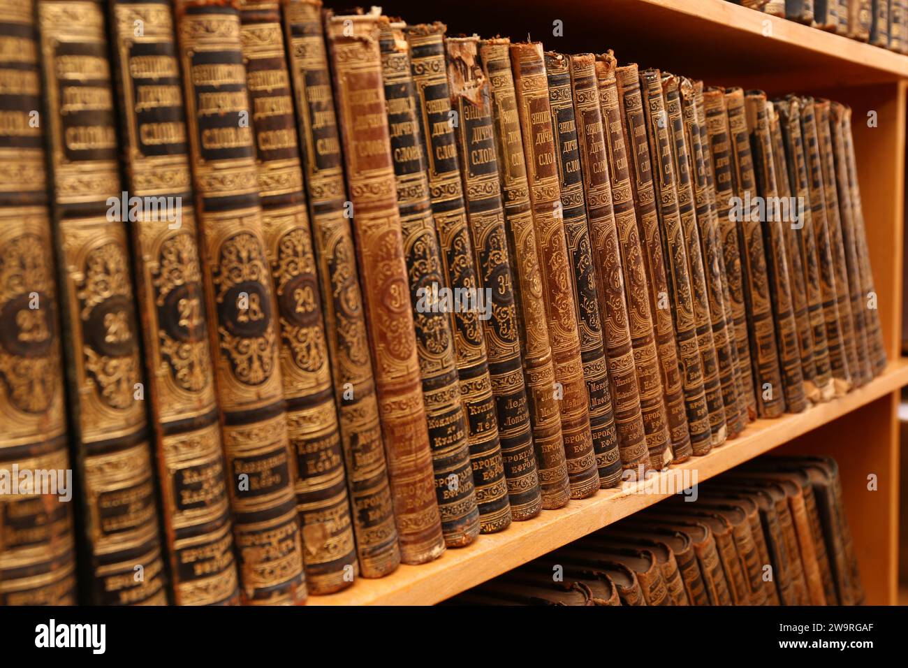 Collection of old books on shelf in library Stock Photo - Alamy