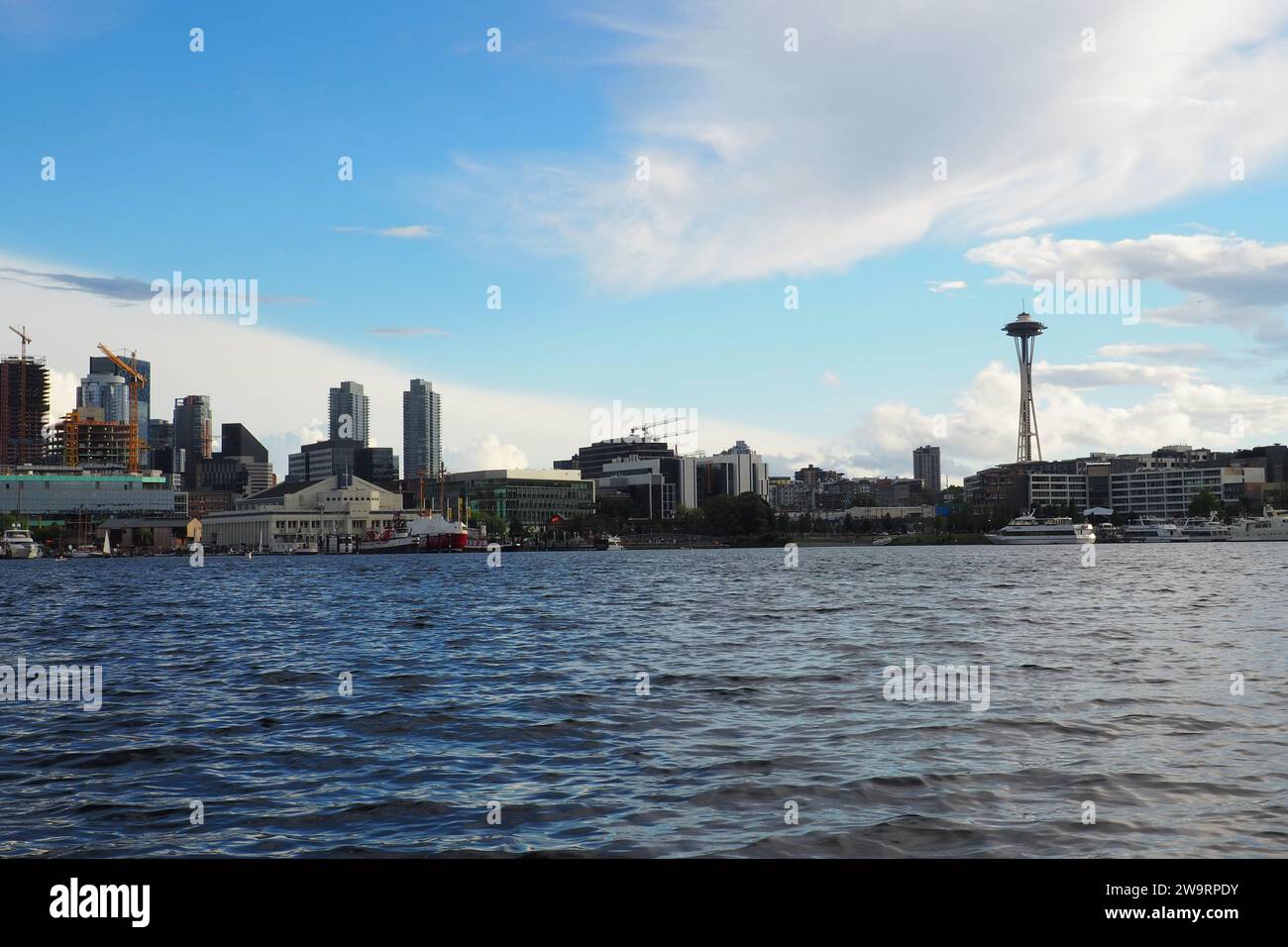 View of Seattle, WA from a boat on Lake Union on a sunny day, including South Lake Union, Queen Ann, and the Space Needle. Stock Photo