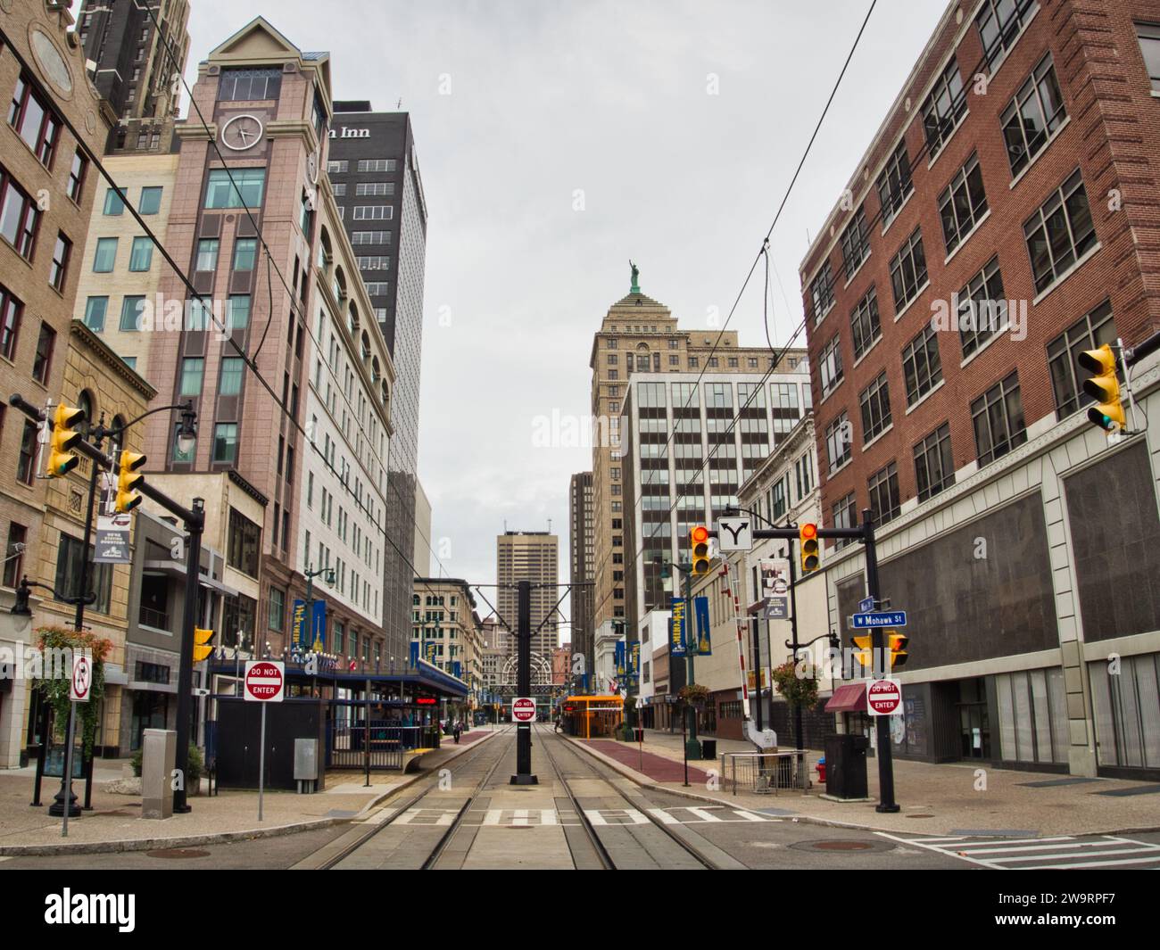 Downtown Buffalo, NY at the intersection of Mohawk and Main Streets. Business district with red traffic light and street car tracks. Stock Photo
