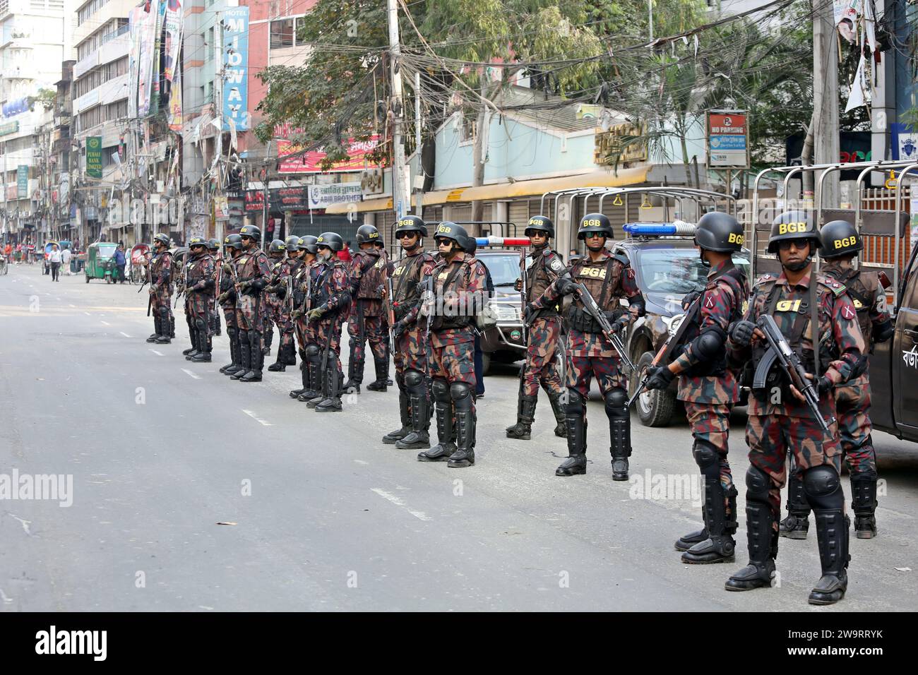 Dhaka, Wari, Bangladesh. 29th Dec, 2023. Members Of Border Guard Bangladesh (BGB) Stand Guard In A Street For The Upcoming 12th General Election In Dhaka, Bangladesh On December 30, 2023. Election Security Duties Have Started To Help Ensure A Peaceful Atmosphere And Maintain Law And Order Across The Country For The 7 January Polls. According To The Bangladesh Election Commission, The 12th General Election Is Scheduled On 7 January 2024 To Select Members Of The National Parliament In Bangladesh. (Credit Image: © Habibur Rahman/ZUMA Press Wire) EDITORIAL USAGE ONLY! Not for Commercial USAGE! Cre Stock Photo