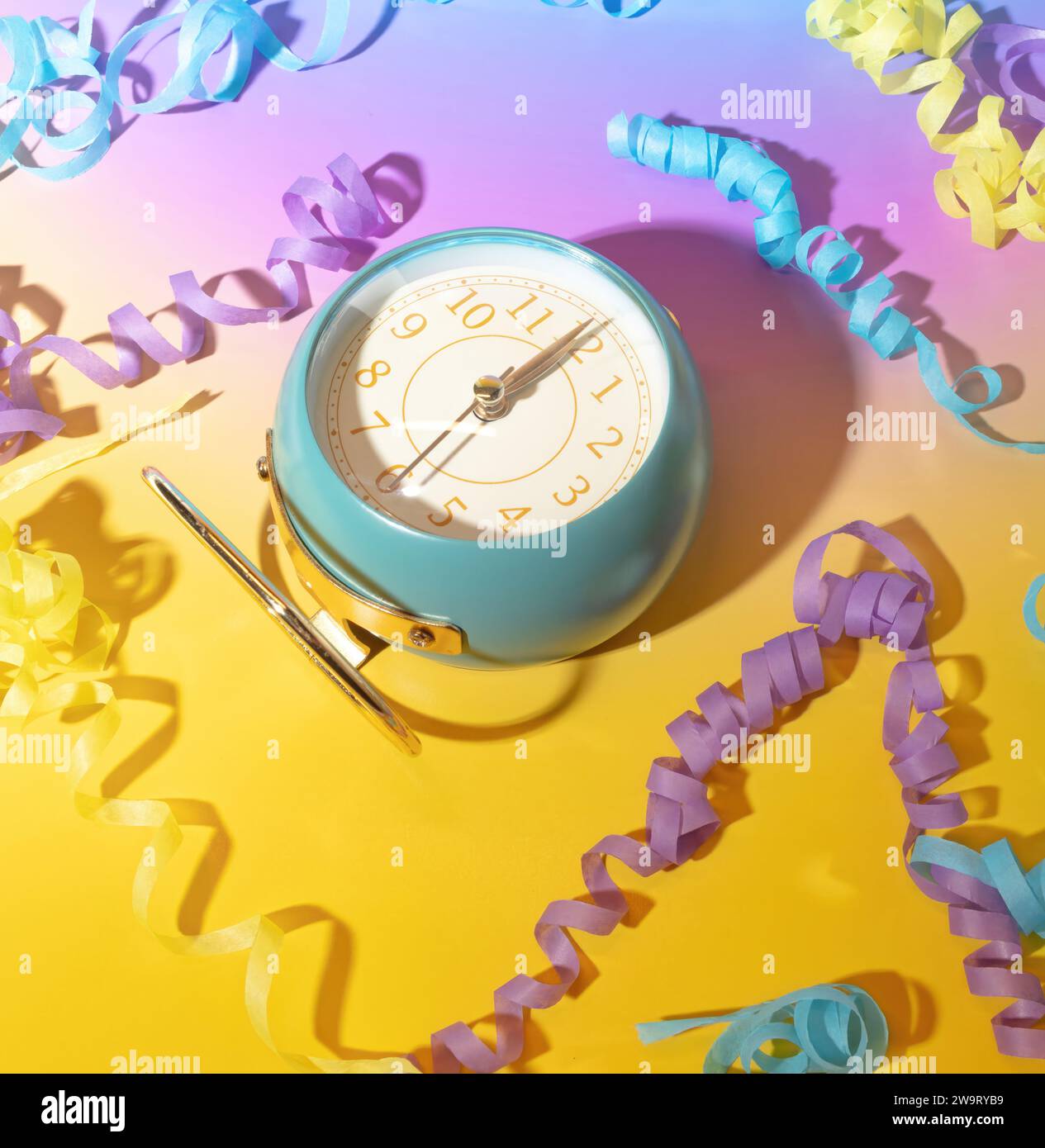 The Clock Strikes Midnight and Party Streamers in New Year's Eve