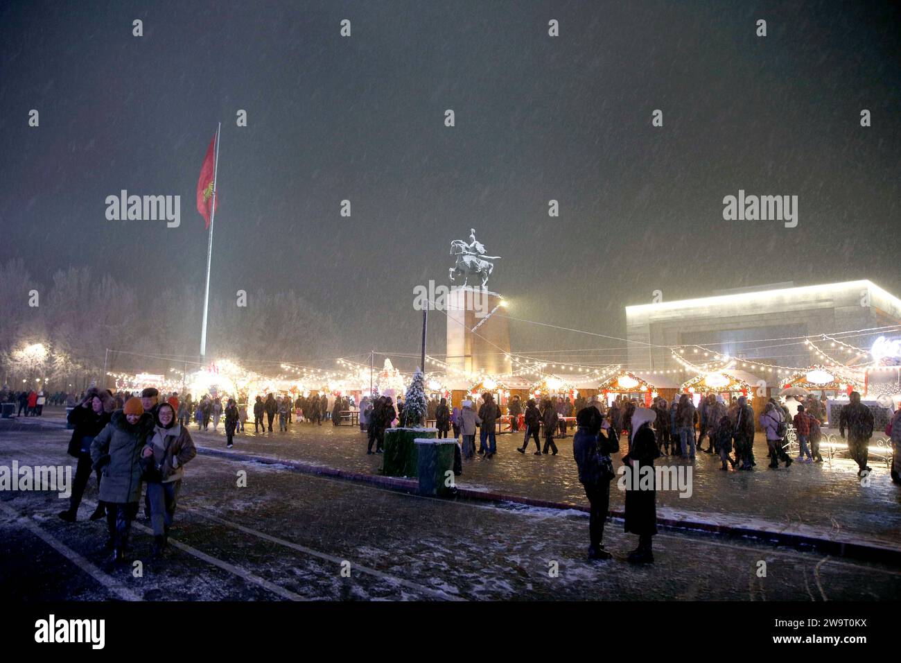 Bishkek, Kyrgyzstan. 29th Dec, 2023. People tour around a food fair at