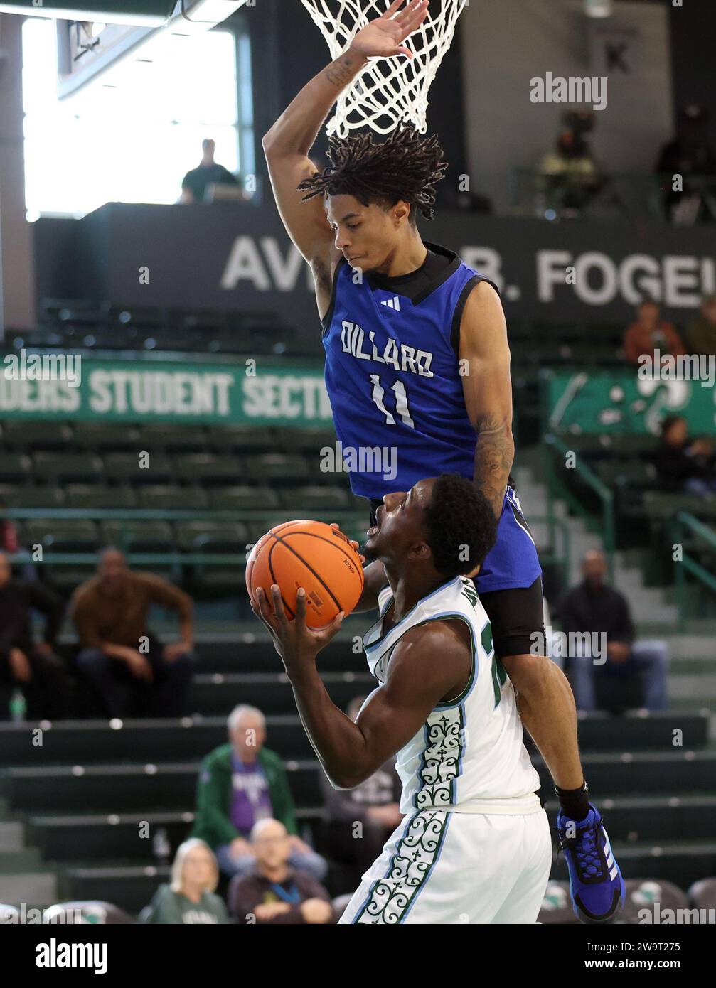 Dillard Bleu Devils guard Justin Warren (11) fouls Tulane Green Wave