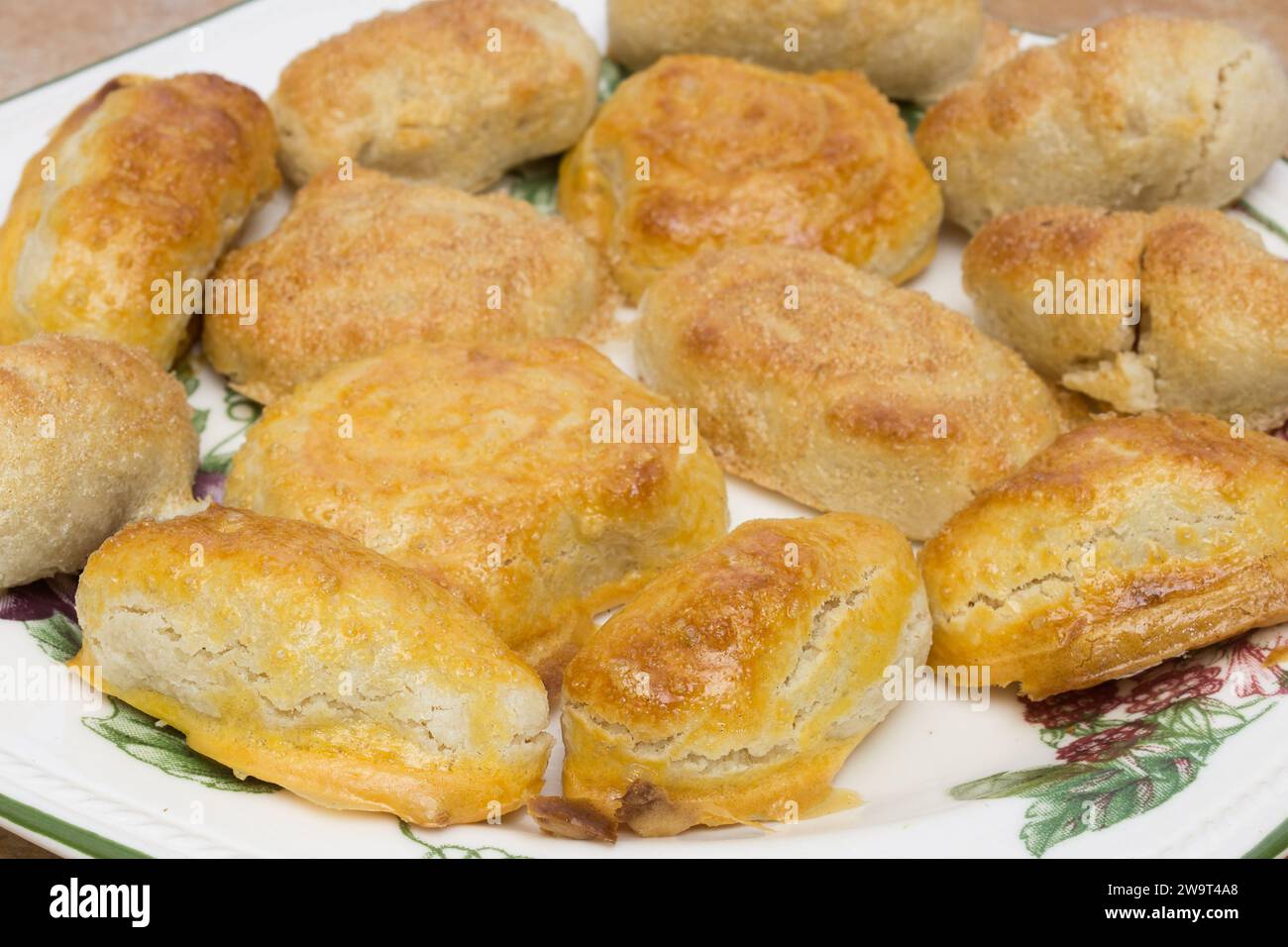 Golden-brown crust-covered homemade almond marzipans: classic Christmas pastries, freshly baked. Stock Photo