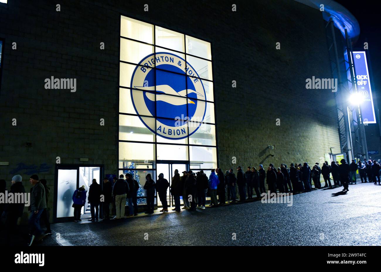 Fans arrive for the Premier League match between Brighton and Hove Albion and Tottenham Hotspur at the American Express Stadium  , Brighton , UK - 28th December 2023 Photo Simon Dack / Telephoto Images  Editorial use only. No merchandising. For Football images FA and Premier League restrictions apply inc. no internet/mobile usage without FAPL license - for details contact Football Dataco Stock Photo