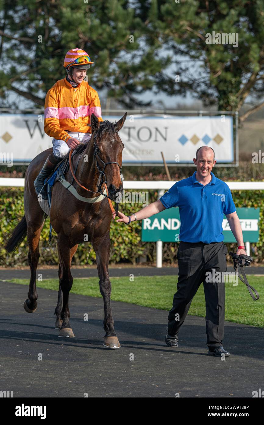 Name in Lights with jockey Brendan Powell and groom Richie in winner's position in the post race parade for the fourth race at Wincanton, March 21st 2 Stock Photo