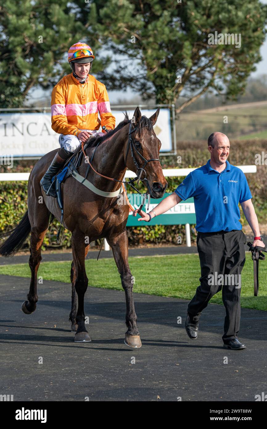 Name in Lights with jockey Brendan Powell and groom Richie in winner's position in the post race parade for the fourth race at Wincanton, March 21st 2 Stock Photo