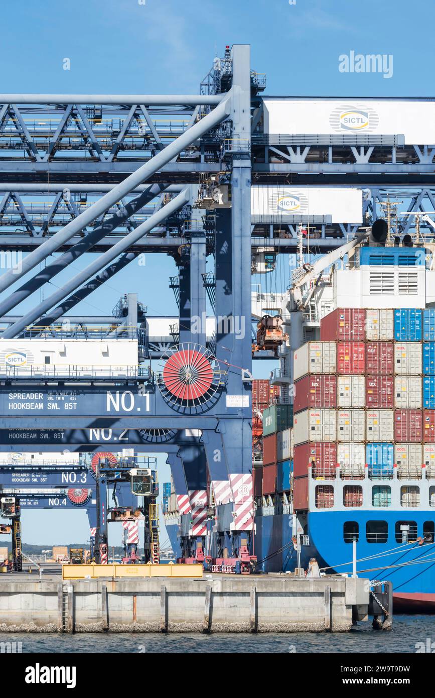 A large fully loaded container vessel moored at Patrick Sydney AutoRail Terminal at Port Botany
