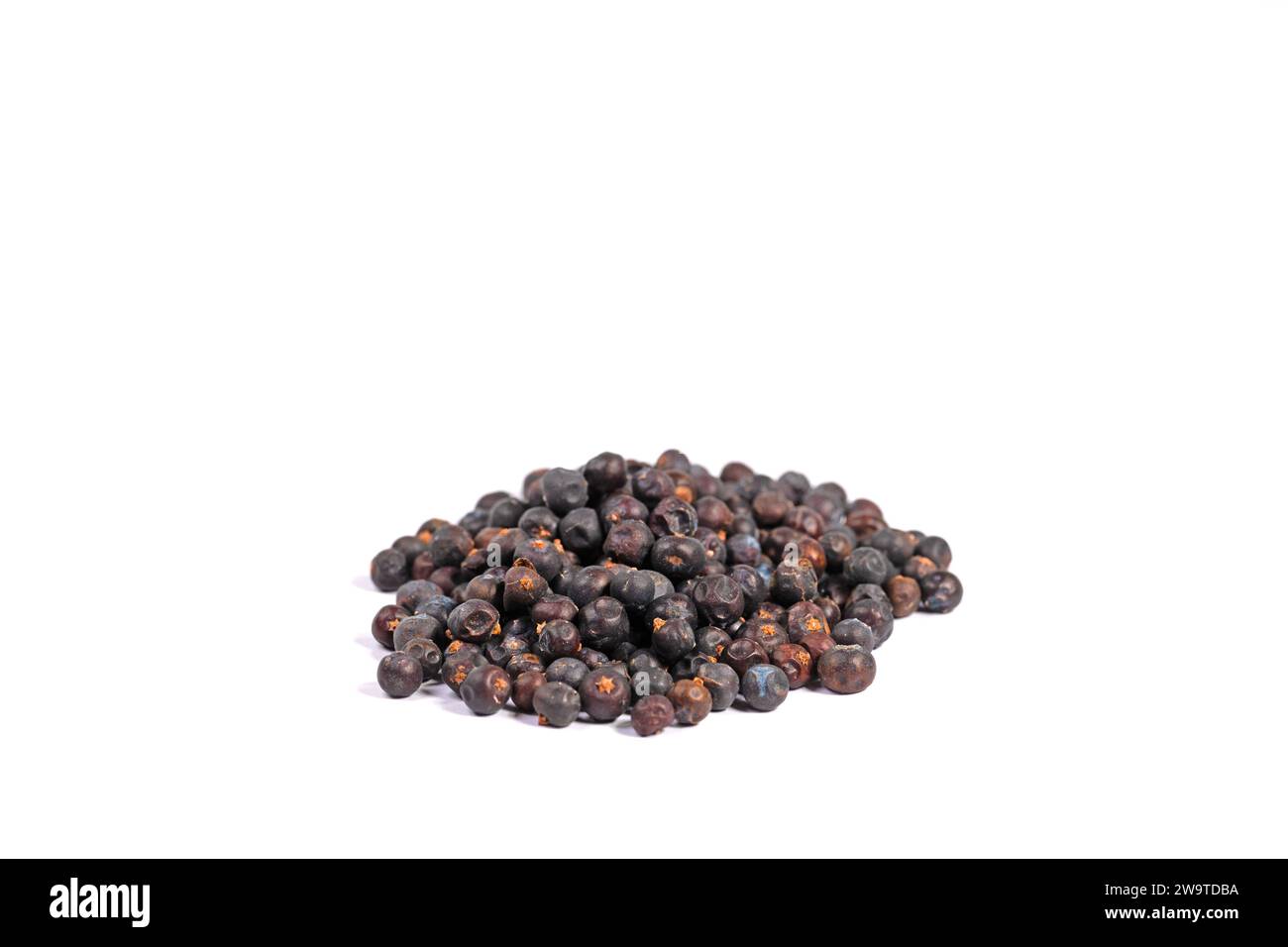 Dried juniper berries against a white background Stock Photo