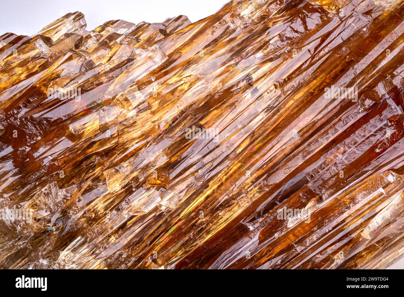 yellow calcite (known as calcite amber) macro detail texture background. close-up raw rough unpolished semi-precious gemstone Stock Photo