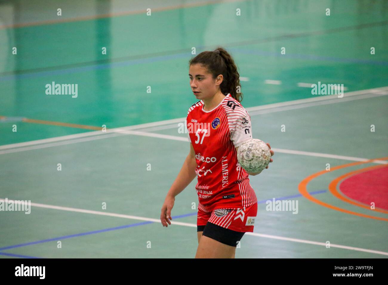 Gijon, Spain. 29th Dec, 2023. The player of Motive.co Gijon Balonmano La Calzada, Rocio Rojas (57) with the ball during the 13th matchday of the Liga Guerreras Iberdrola 2023-24 between Motive.co Gijon Balonmano La Calzada and the Mecalia Atletico Guardes, on December 29, 2023, at the La Arena Pavilion, in Gijon, Spain. (Photo by Alberto Brevers/Pacific Press) Credit: Pacific Press Media Production Corp./Alamy Live News Stock Photo