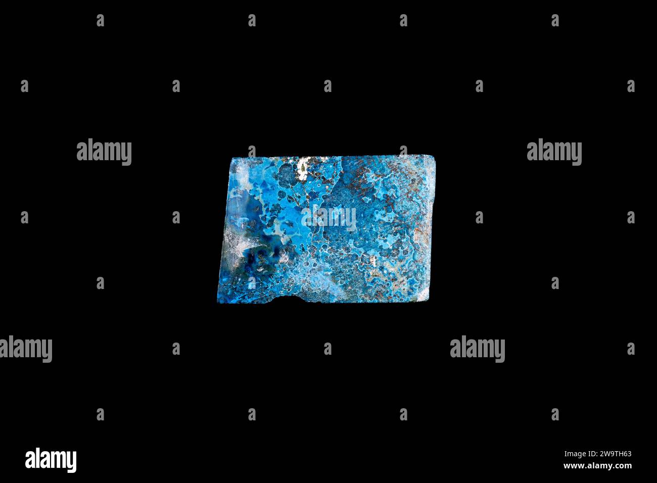 shattuckite blue slice macro detail black isolated background. close-up polished semi-precious gemstone copy space. Stock Photo