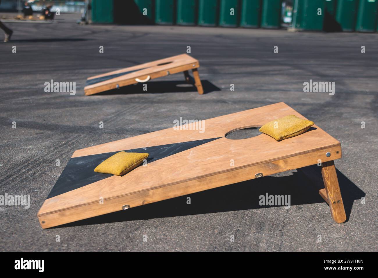 Cornhole game set, process of throwing bean bags, kids children tossing