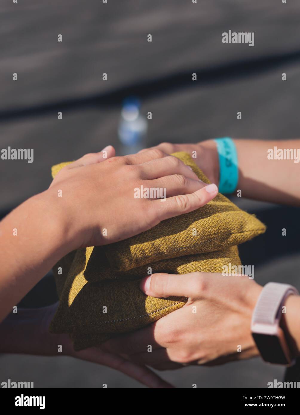 Cornhole game set, process of throwing bean bags, kids children tossing