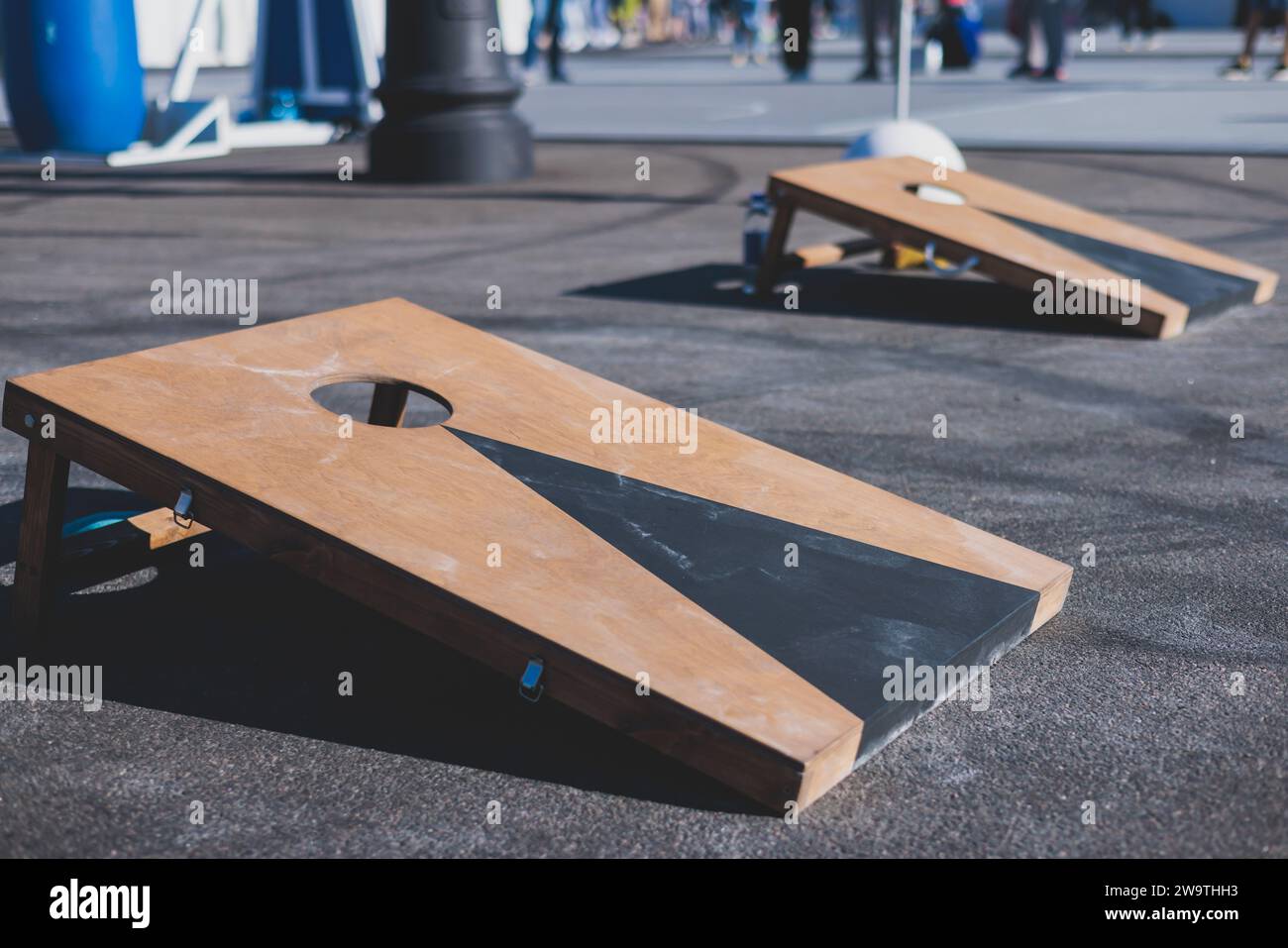 Cornhole game set, process of throwing bean bags, kids children tossing ...