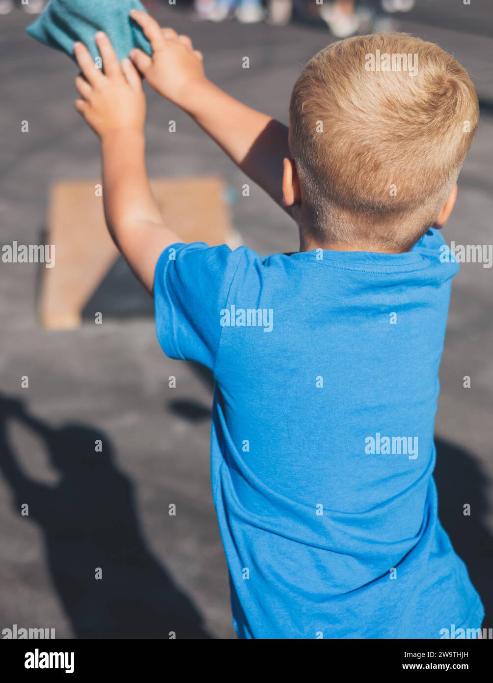 Cornhole game set, process of throwing bean bags, kids children tossing ...