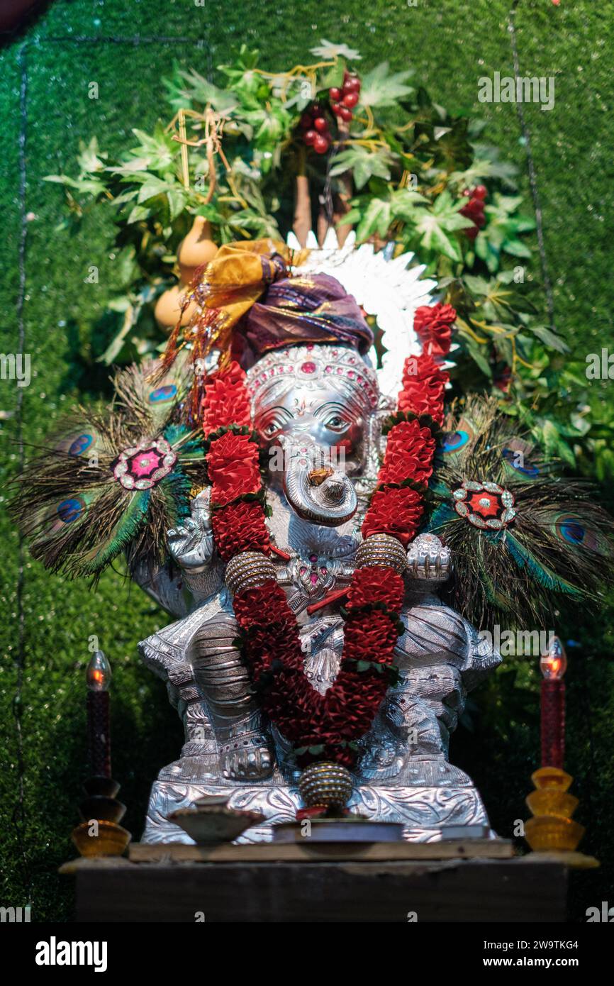 Silver Ganesha Structure with Decorative Accessories Stock Photo