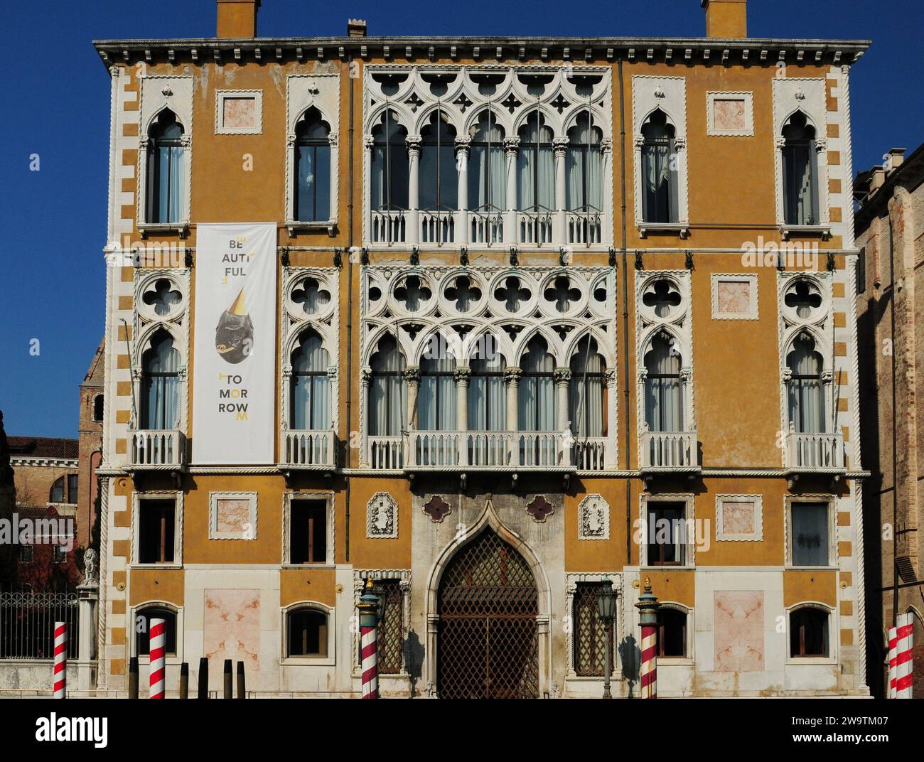 Facade Of The Venetian Renaissance Style Palazzo Franchetti On The Canale Grande In Venice Italy On A Wonderful Spring Day With A Clear Blue Sky Stock Photo