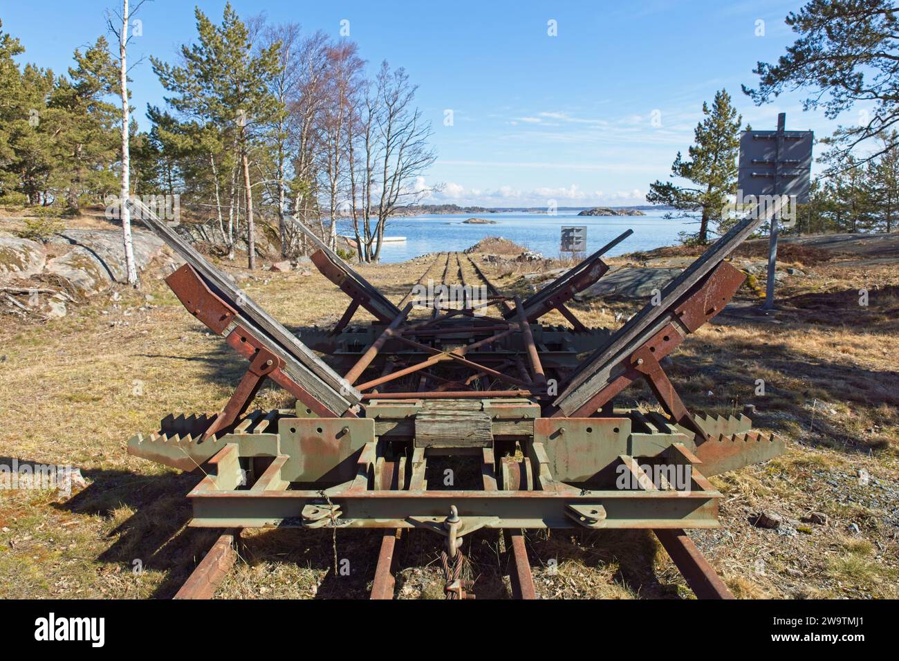 An old rusty rail boat ramp or boat deployer on platform, Örö, Kemiönsaari, Finland. Stock Photo