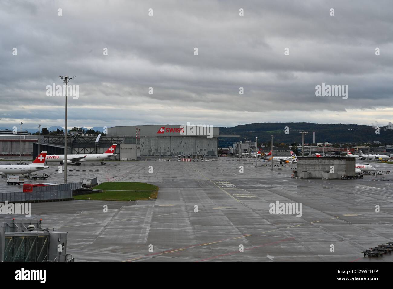 Wet area of Zurich airport where  planes of Swiss airlines company are parked. Stock Photo