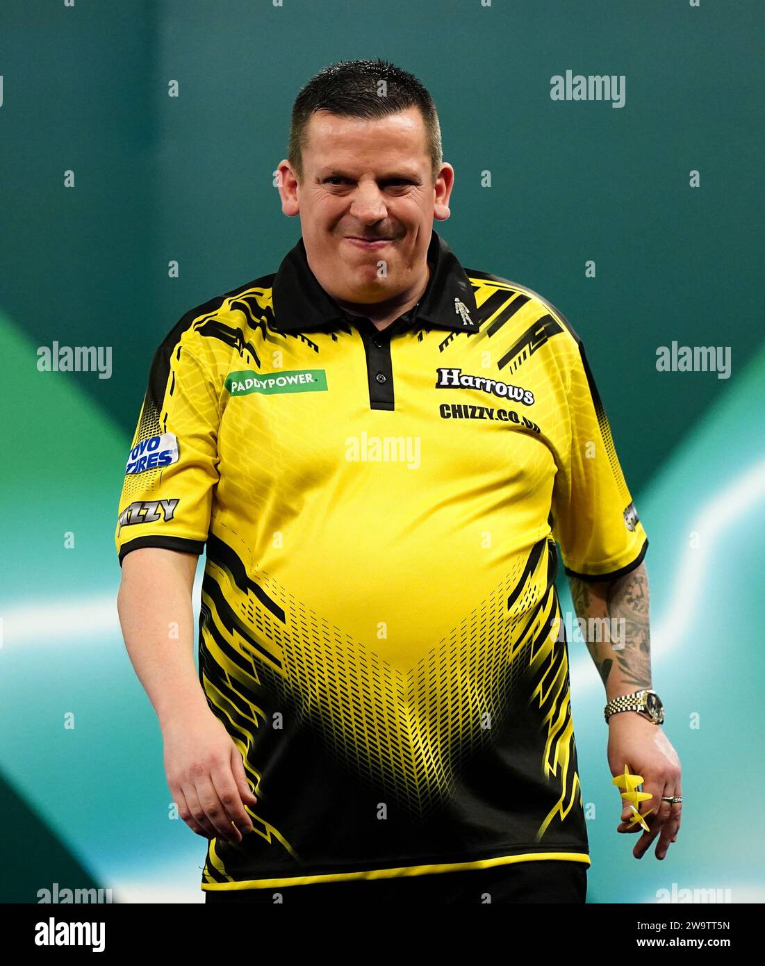 Dave Chisnall in action against Daryl Gurney (not pictured) on day thirteen of the Paddy Power World Darts Championship at Alexandra Palace, London. Picture date: Saturday December 30, 2023. Stock Photo