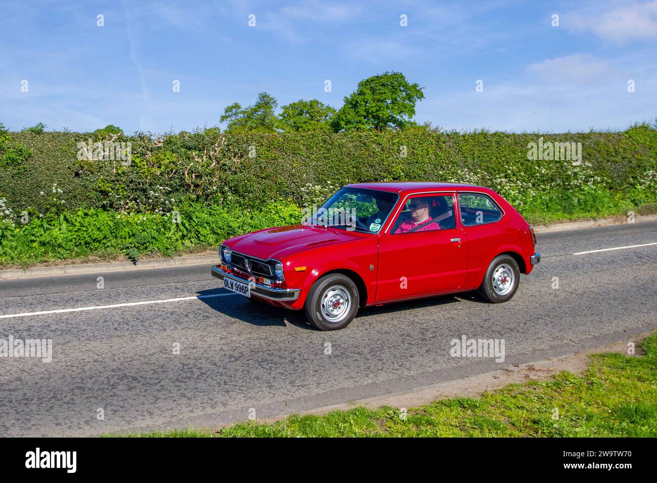 Rare 1976 70s seventies Red Honda Civic 3D At Auto Car Petrol 1169 cc,  three-door hatchback; Vintage restored classic specialist motors vehicle restoration, automobile collectors, yesteryear motoring enthusiasts and historic veteran cars travelling in Cheshire, UK Stock Photo