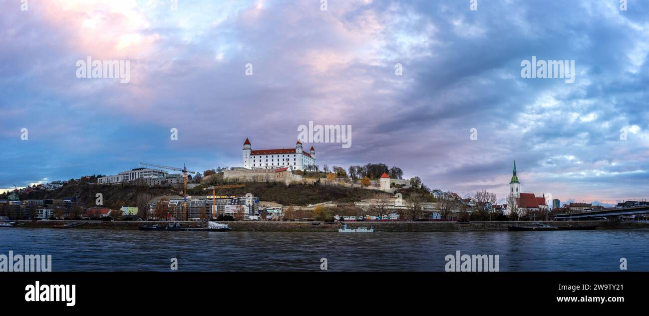 View to Bratislava Castle at sunrise from the Danube river. Stock Photo