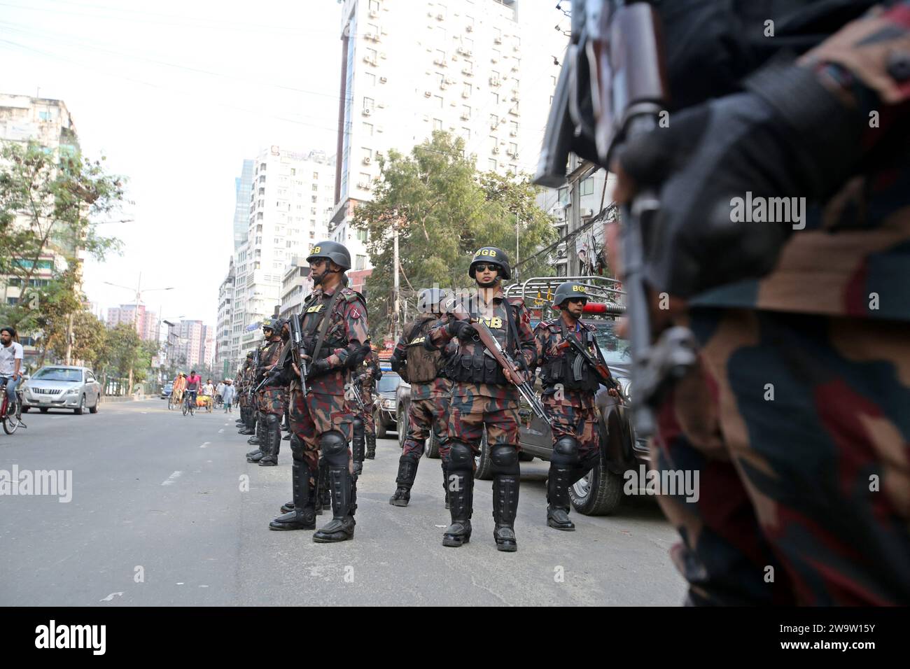 Dhaka, Bangladesh. 30th Dec, 2023. Members Of Border Guard Bangladesh (BGB) Stand Guard In A Street For The Upcoming 12th General Election In Dhaka, Bangladesh On December 30, 2023. Election Security Duties Have Started To Help Ensure A Peaceful Atmosphere And Maintain Law And Order Across The Country For The 7 January Polls. According To The Bangladesh Election Commission, The 12th General Election Is Scheduled On 7 January 2024 To Select Members Of The National Parliament In Bangladesh. Photo by Habibur Rahman/ABACAPRESS.COM Credit: Abaca Press/Alamy Live News Stock Photo