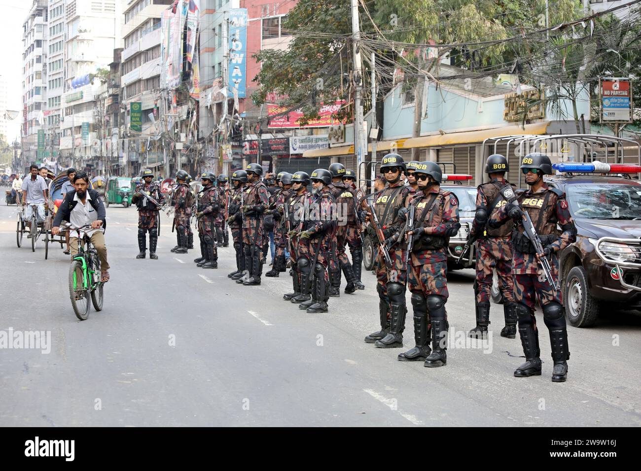 Dhaka, Bangladesh. 30th Dec, 2023. Members Of Border Guard Bangladesh (BGB) Stand Guard In A Street For The Upcoming 12th General Election In Dhaka, Bangladesh On December 30, 2023. Election Security Duties Have Started To Help Ensure A Peaceful Atmosphere And Maintain Law And Order Across The Country For The 7 January Polls. According To The Bangladesh Election Commission, The 12th General Election Is Scheduled On 7 January 2024 To Select Members Of The National Parliament In Bangladesh. Photo by Habibur Rahman/ABACAPRESS.COM Credit: Abaca Press/Alamy Live News Stock Photo
