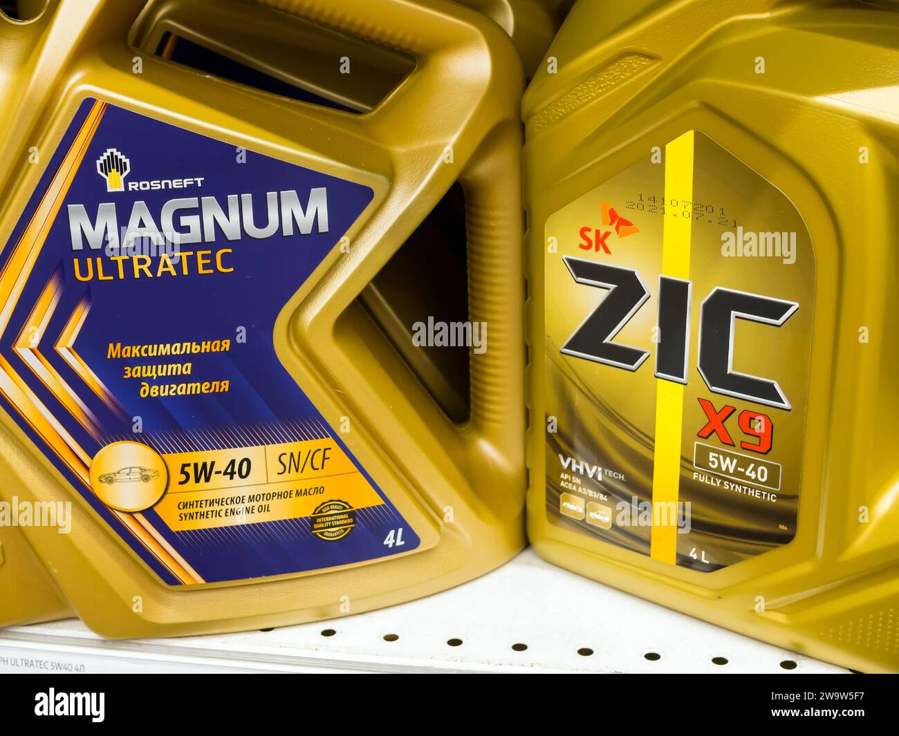 Voronezh - Russia, December 25, 2022: Canisters with MAGNUM and ZIC engine oils Stock Photo