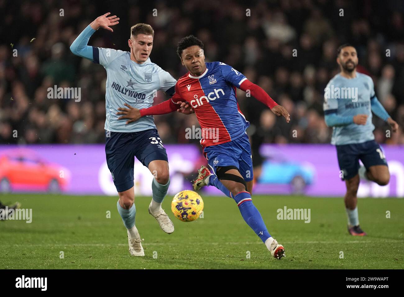 Brentford's Yehor Yarmolyuk (left) and Crystal Palace's Matheus Franca battle for the ball during the Premier League match at Selhurst Park, London. Picture date: Saturday December 30, 2023. Stock Photo