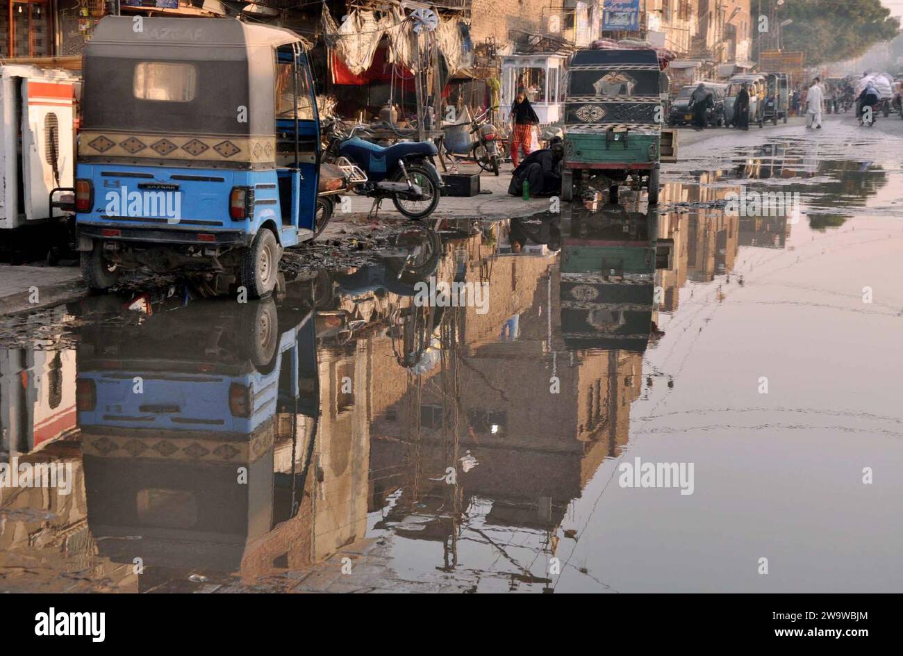 HYDERABAD, PAKISTAN, DEC 30 Inundated road by overflowing sewerage