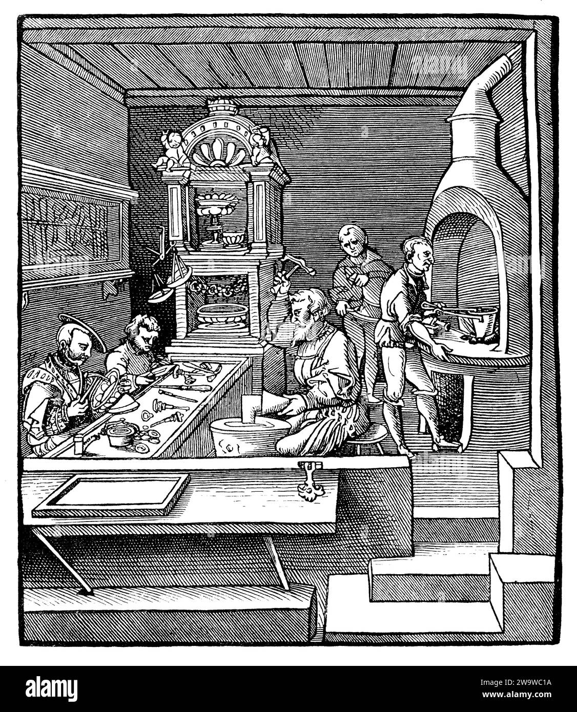 16th century - goldsmith workshop working with gold and precious metals to make silverware,jewelry,platters and decorative items Stock Photo