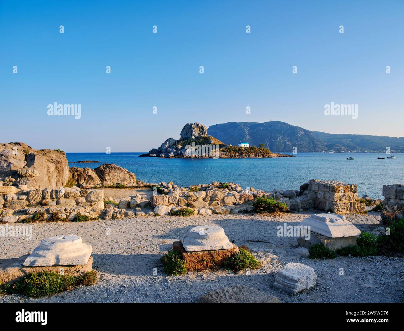 St. Stefanos Basilica Ruins and Kastri Island at sunset, Agios Stefanos ...