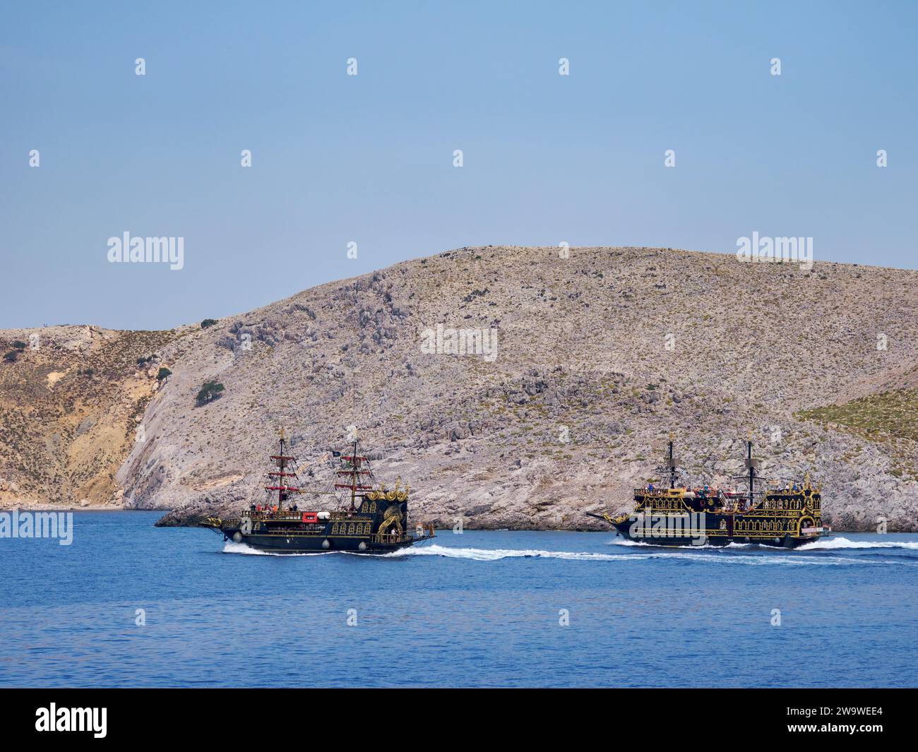 Ships by the coast of Pserimos Island, Dodecanese, Greece Stock Photo