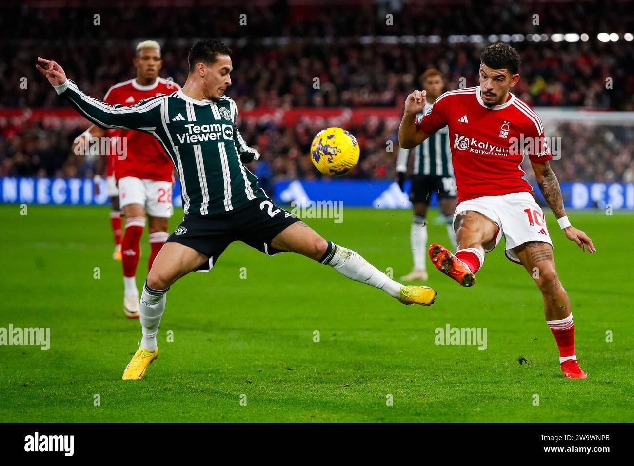 The City Ground, Nottingham, UK. 30th Dec, 2023. Premier League Football, Nottingham Forest versus Manchester United; Anthony of Manchester United tackles Morgan Gibbs-White of Nottingham Forest Credit: Action Plus Sports/Alamy Live News Stock Photo