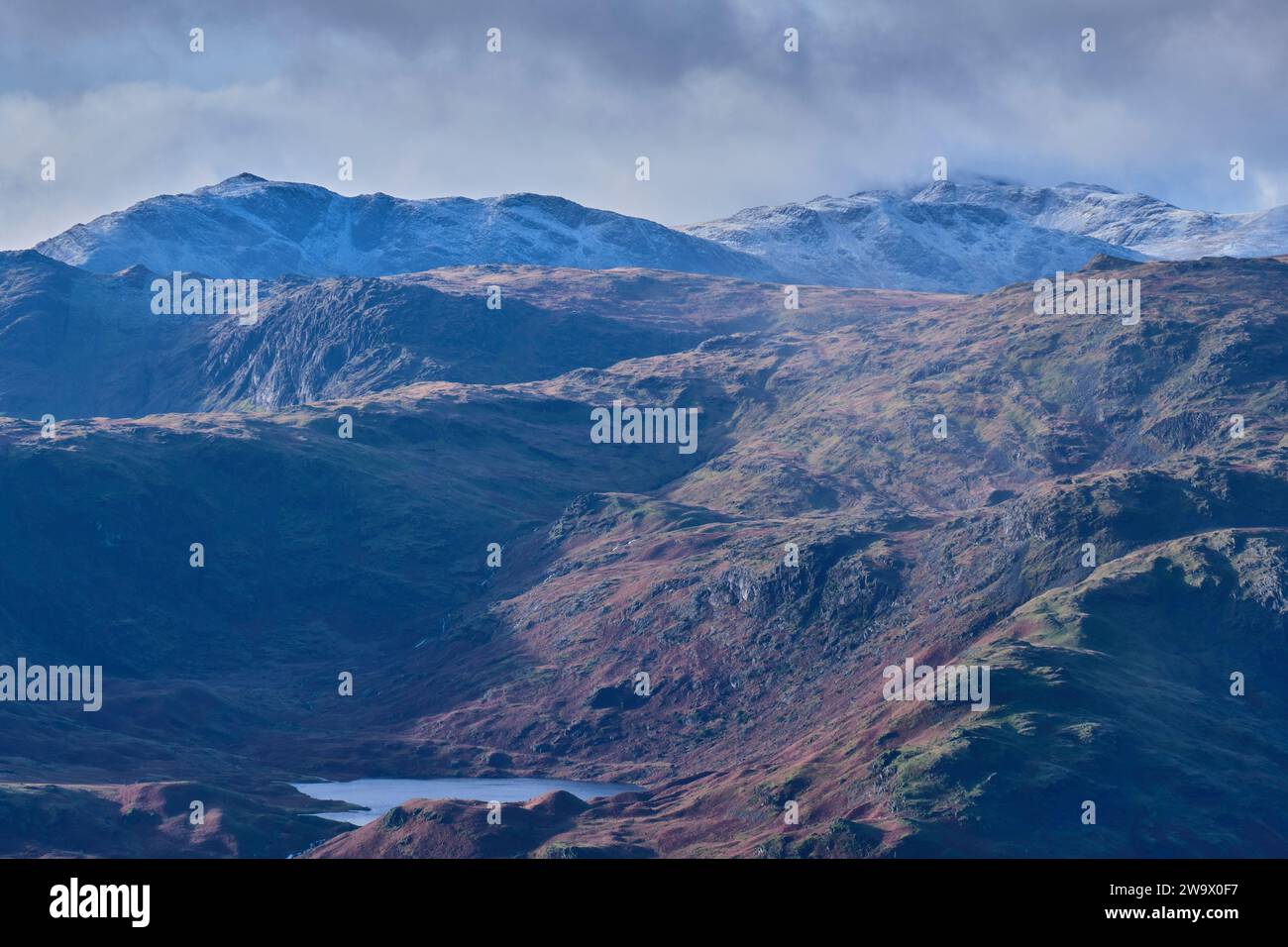 Easedale Tarn, Bowfell, and Esk Pike seen from near Great Rigg, Grasmere, Lake District, Cumbria Stock Photo