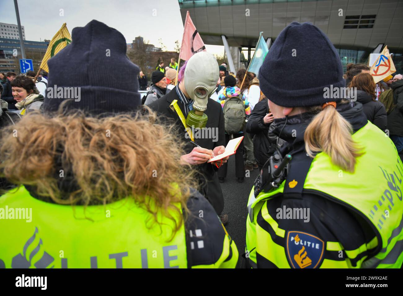 Amsterdam,The Netherlands,30th december,2023.Extinction rebellion blocked the A10 highway to protest against investments by ING in polluting projects. Police removed and arrested a few hundred people.Credit:Pmvfoto/Alamy Live News Stock Photo