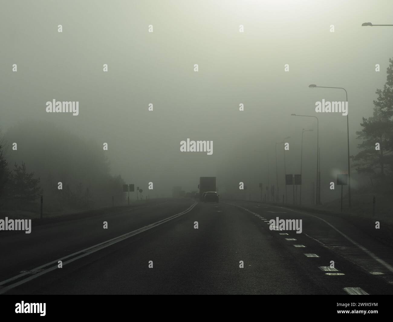 Cars in the fog, bad visibility Stock Photo