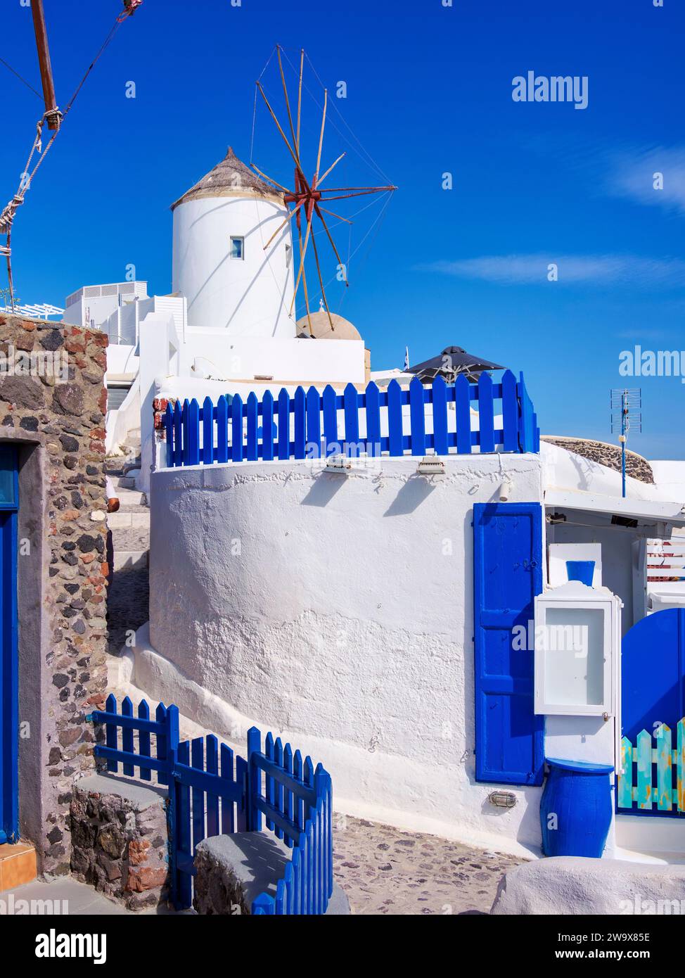 Windmill in Oia Village, Santorini or Thira Island, Cyclades, Greece Stock Photo