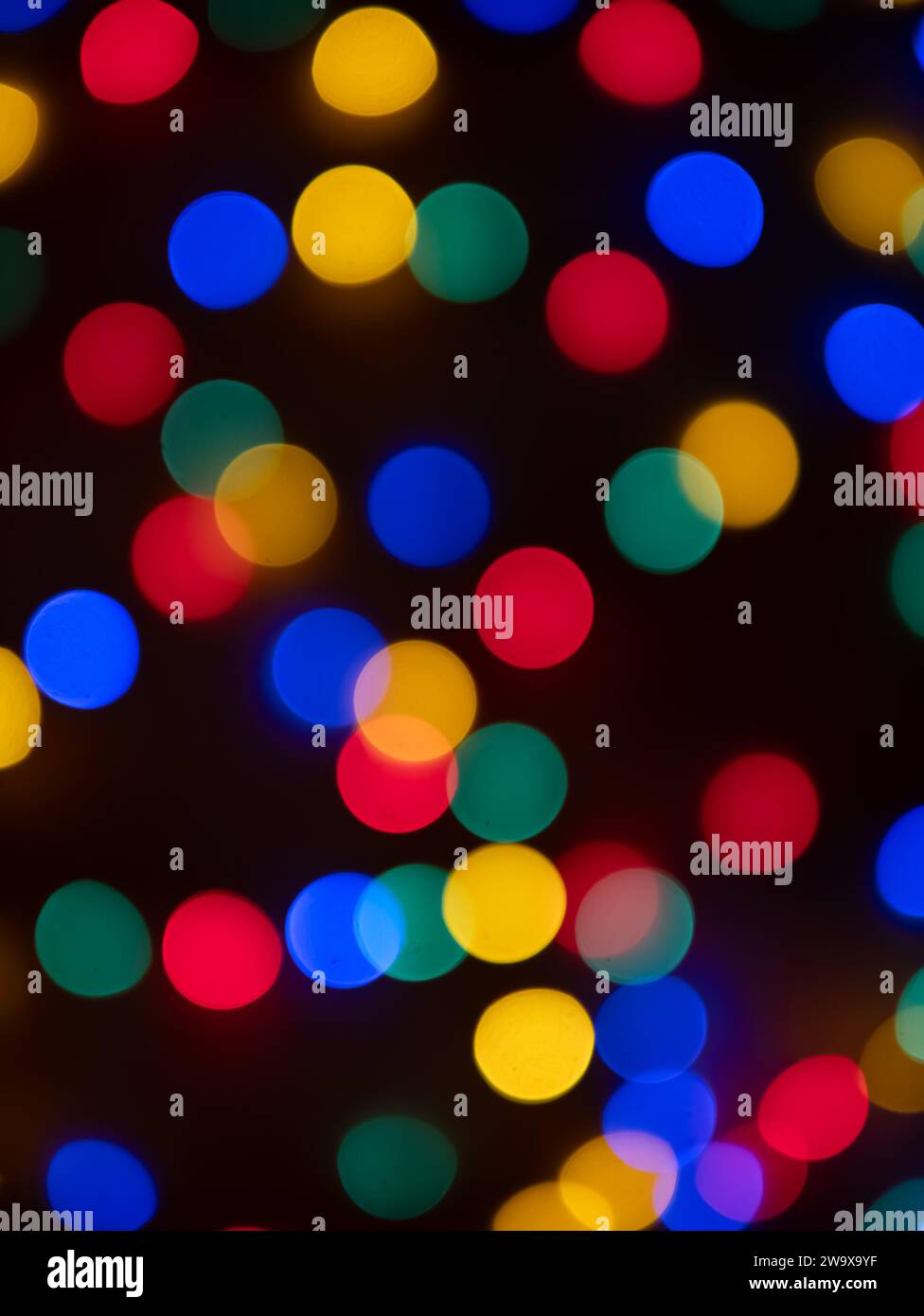 abstract background with blured colored light circles on dark background Stock Photo