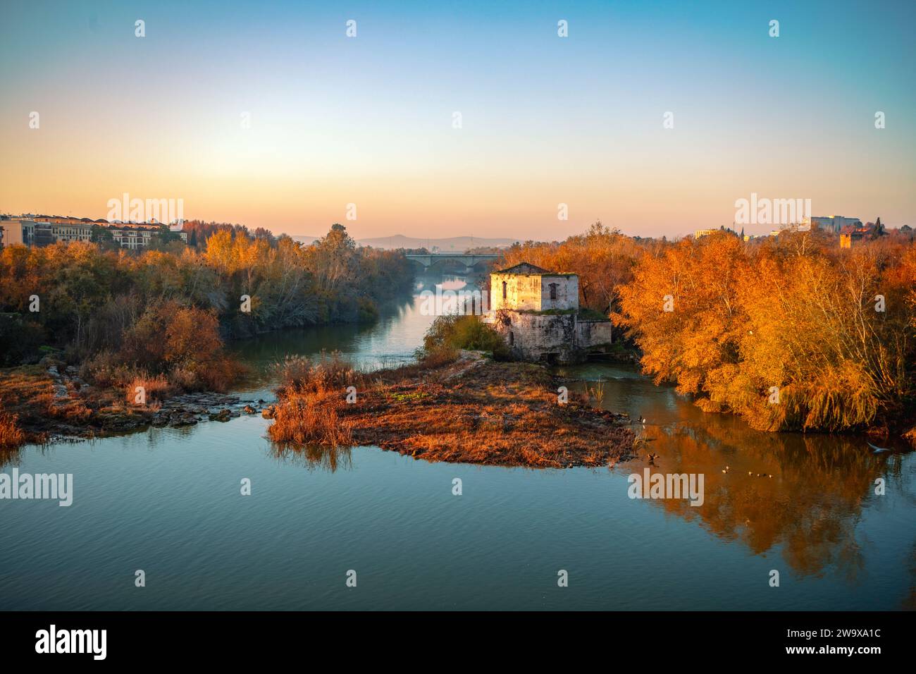 Sotos de la Albolafia on the Guadalquivir River at dawn in Cordoba, Andalusia, Spain with the Molino de Don Tello in the center Stock Photo