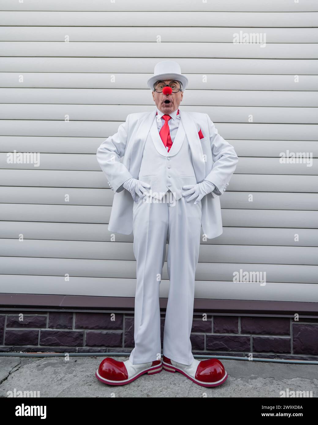 Portrait strange clown in suit hi-res stock photography and images - Alamy